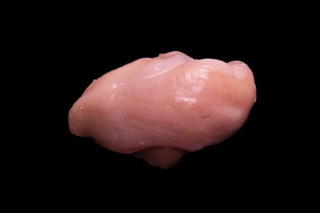 Raw chicken fillet isolated on a black background. top view.