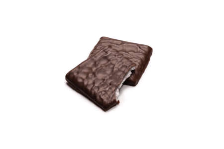 Dark chocolate candies isolated on a white background.