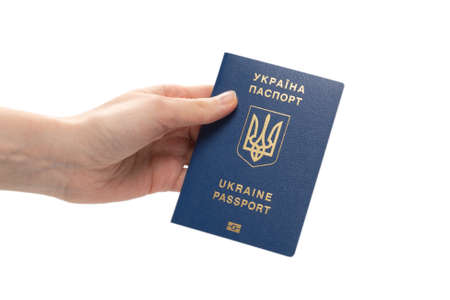 Ukrainian biometric passport in woman hand isolated on a white background.の写真素材