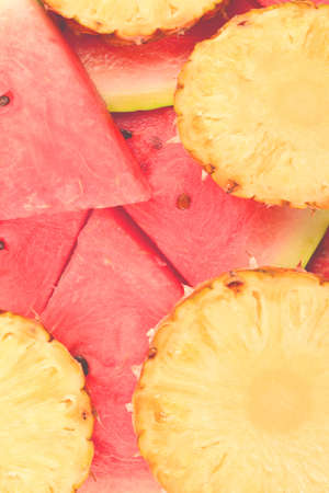 Pineapple and watermelon slices background.の写真素材