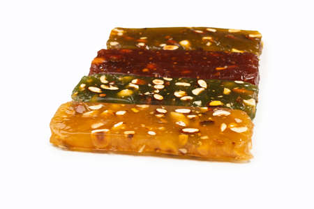 Turkish traditional delight with nuts isolated on a white background.