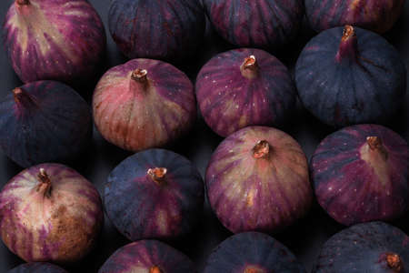 Tasty figs on a black background. top view. slices.の写真素材