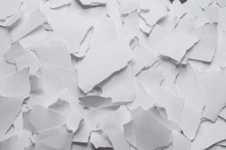 Empty white paper pieces as a background. Space for text or design.の写真素材