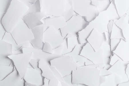 Empty white paper pieces as a background. Space for text or design.の写真素材