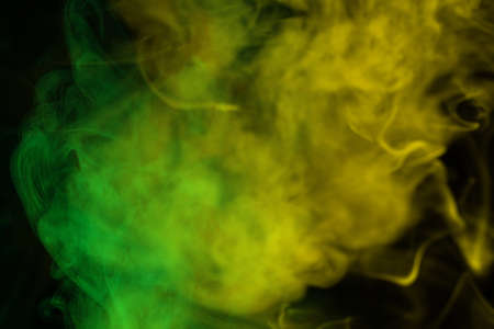 Green steam on a black background. Copy space.の写真素材