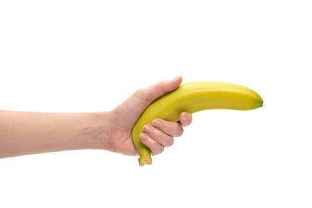A bunch of bananas in woman hand isolated on a white background.の写真素材