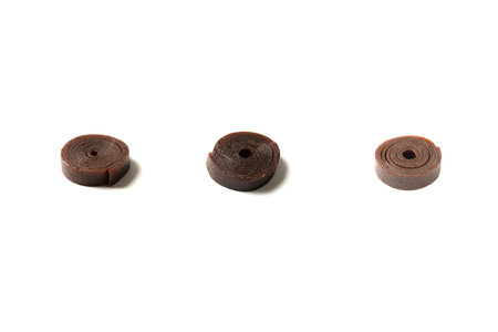 Natural dessert, fruit pastille isolated on a white background. Natural candy, pastille roll.