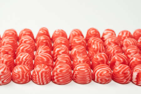 Red round tasty gummy candies islolated on a white background.の写真素材