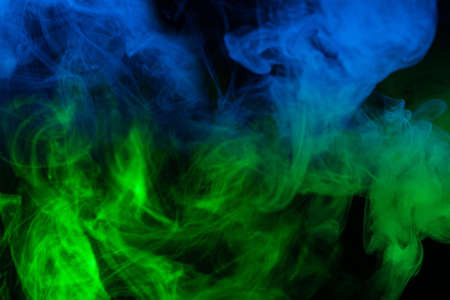 Blue steam on a black background. Copy space.の写真素材