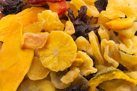 Mix of dried exotic fruit, mangos, slices of pineapples, passion fruit, papaya. Vegetarian dessert.の写真素材