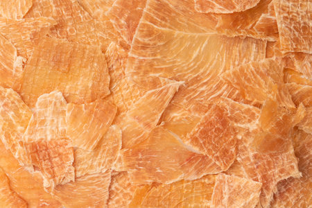 A group of tasty beer snacks. Dehydrated chicken meat slices.の写真素材