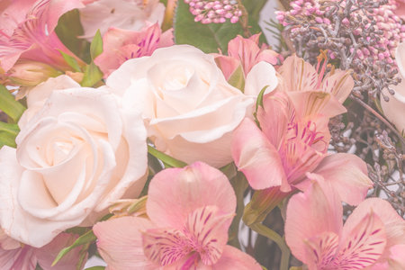 Bouquet of soft pink flowers in pink wrapping paper.の写真素材