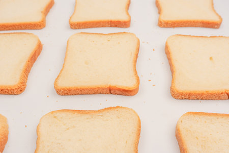 Delicious bread slices isolated on a white background, top view.の写真素材