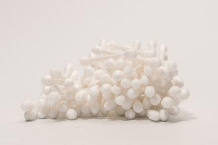 Group of white cotton buds isolated on a white background.