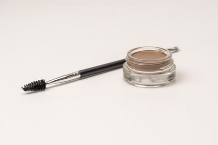 A brow pomade in blonde shade with brush isolated on a white background. make up.の写真素材