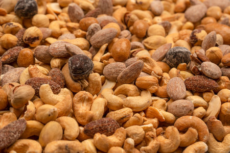Mix of tasty salty nuts. A group of almonds, pistachios, walnuts, macadamia, cashews.の写真素材