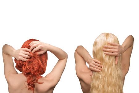 Woman with long blond and curly hair. Woman back isolated.の写真素材