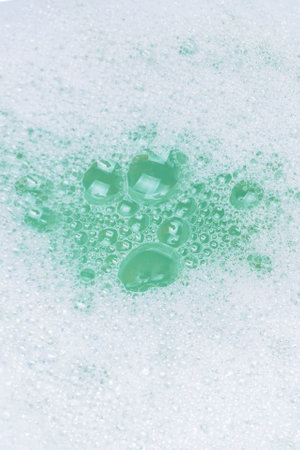 Green lather background, top view. copyspace.