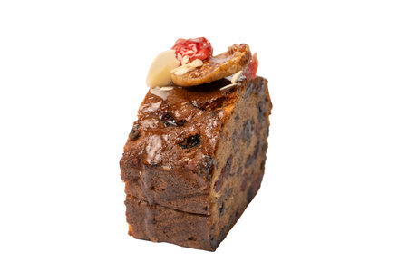 A cake with dried fruits, raisins almonds, dried strawberry, dried apricots.の写真素材