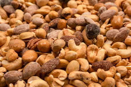 Mix of tasty salty nuts. A group of almonds, pistachios, walnuts, macadamia, cashews.の写真素材