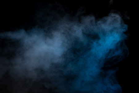 Blue and yellow steam on a black background. copyspace.の写真素材