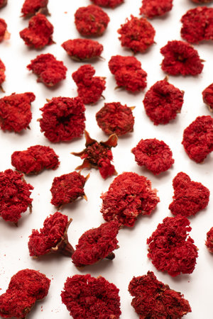 Dried pomegranate flower isolated on a white background. top view.の写真素材