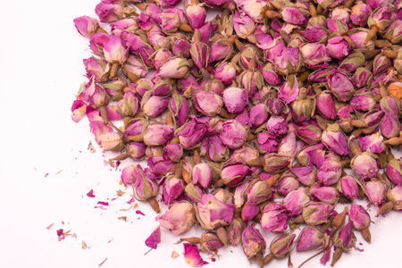 Dry tea roses isolated on a white background.の写真素材