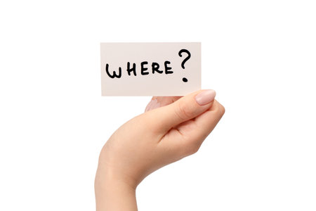 Where text on a card in a woman hand isolated on a white background.の写真素材