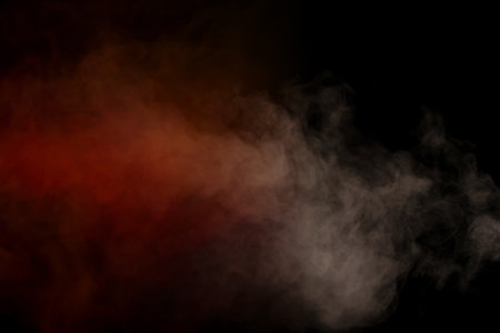 Orange and red steam on a black background. copyspace.の写真素材