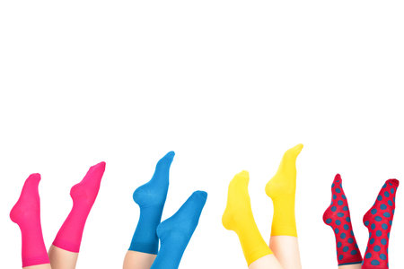 Woman in purple socks isolated on white background. Top view.