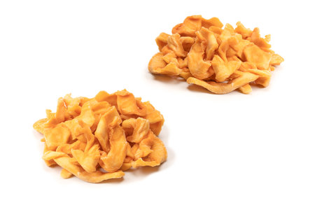 Dried melon slices isolated on a white background. Dried fruit.の写真素材