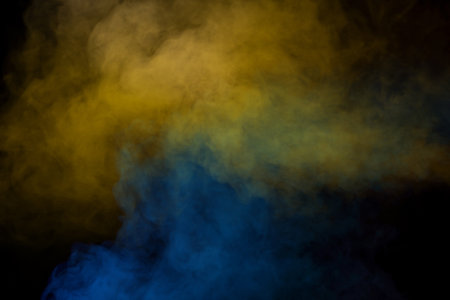 Blue and yellow steam on a black background. copyspace.の写真素材