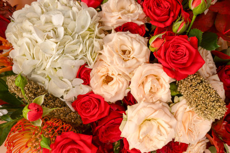 Autumn bouquet of red and white roses, hydrangeas, chrysanthemums as a background. Top view.の写真素材