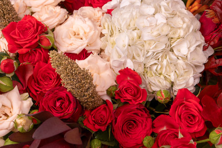 Autumn bouquet of red and white roses, hydrangeas, chrysanthemums as a background. Top view.の写真素材