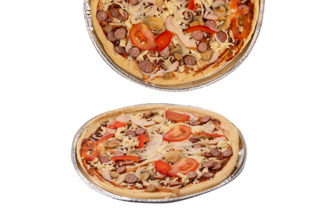 Tasty pizza with salami, sausages, cheese, onions and sauce. isolated on a white background.の写真素材