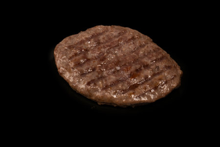 Cutlet with minced beef isolated on a black background.の写真素材