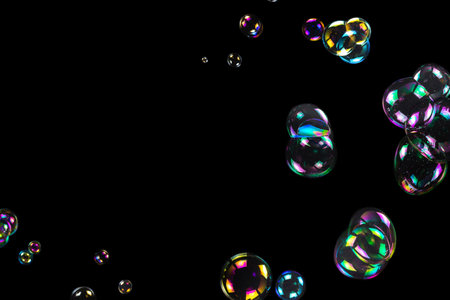 Soap bubbles isolated on a black background. Copy space.の写真素材