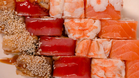 Sushi rolls with salmon, shrimp, eel, tuna isolated on a white background.の写真素材