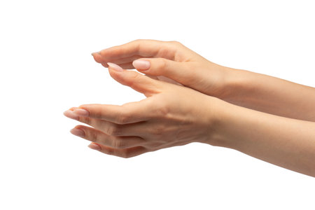 Hand of a woman hold some tiny or thin object, isolated on a white background.の写真素材