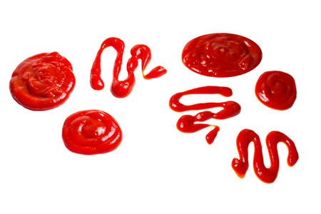 Ketchup and yellow sauce splashes isolated on white background.の写真素材