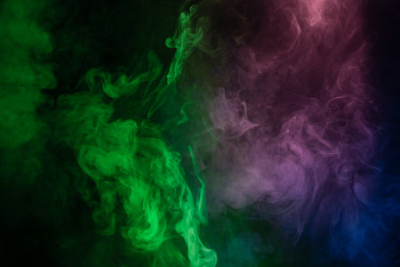 Blue and pink steam on a black background. Copy space.の写真素材
