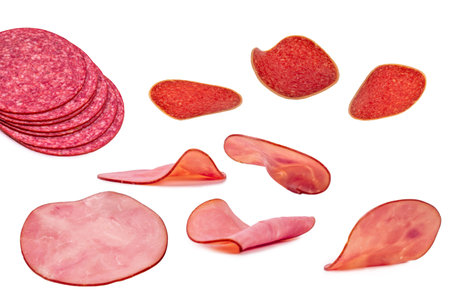 Falling tasty salami isolated on a white background.の写真素材