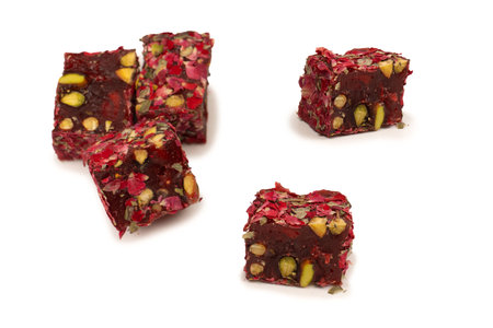 Sweet roll with roses and nuts, Turkish sweets. Turkish rahat isolated on a white background.の写真素材