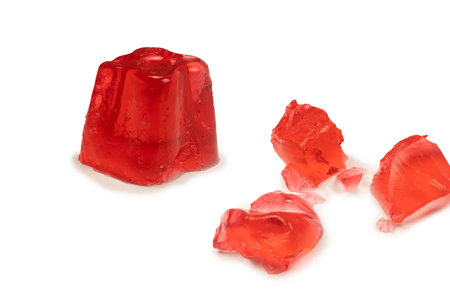 Sweet fruit jelly dessert isolated on a white background. gelatin cubes.の写真素材