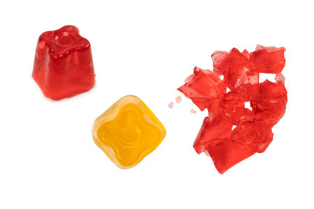 Sweet fruit jelly dessert isolated on a white background. gelatin cubes.の写真素材
