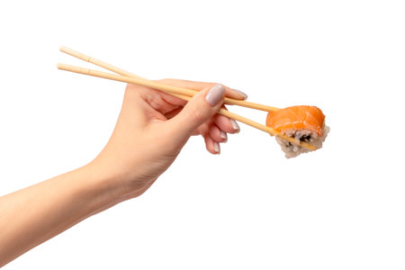 Sashimi with salmon in a woman hand isolated on a white background.の写真素材