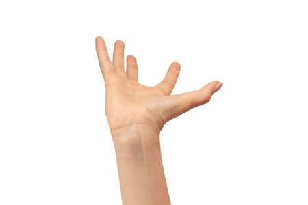 Hand of a woman hold some tiny or thin object, isolated on a white background.の写真素材