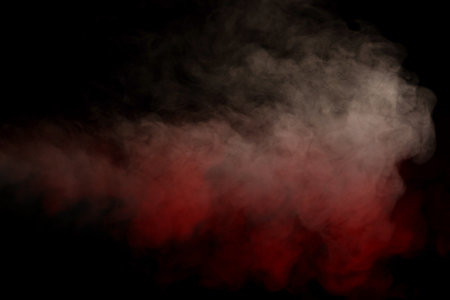 Orange and red steam on a black background. copyspace.の写真素材