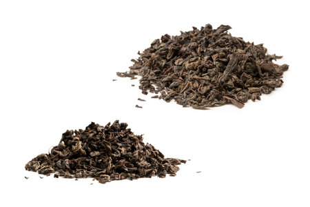 Dried tea leaves isolated on a white background. top view.の写真素材