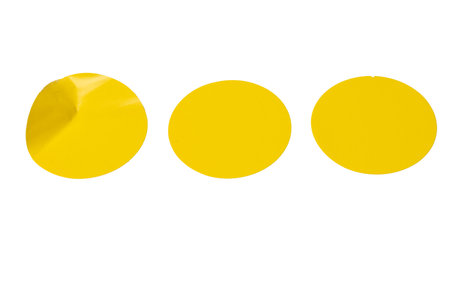 Round yellow stickers, blank tags labels isolated on a white background. Top view.の写真素材
